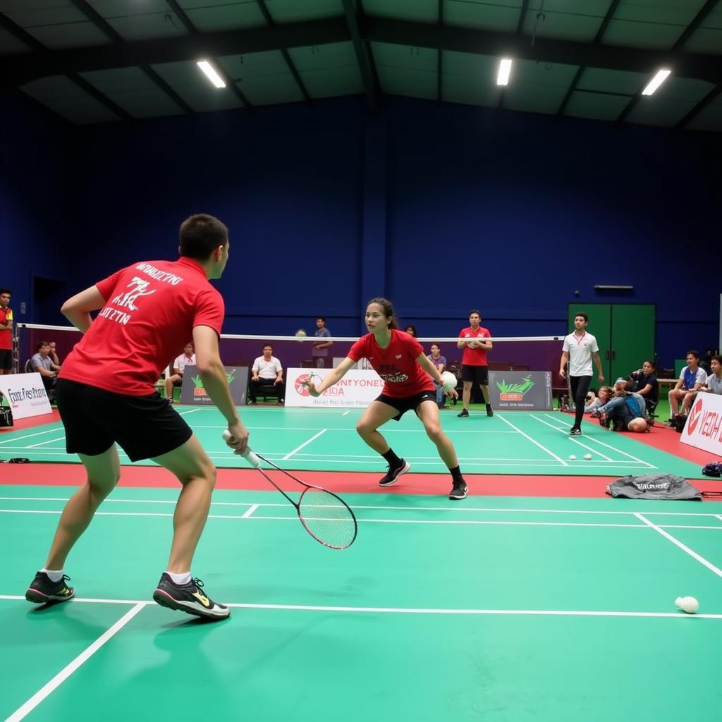 Players in action on a badminton court